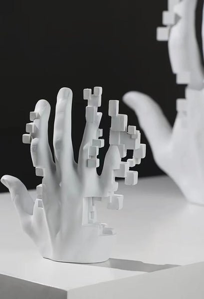 A Handcrafted White Resin Art Statue for Home Decor - Modern Simplicity Design by The Stuff Box, with extruding rectangular blocks, made from handcrafted resin material, is placed on a white surface. A similar piece, showcasing modern and elegant design, is partially visible in the background.