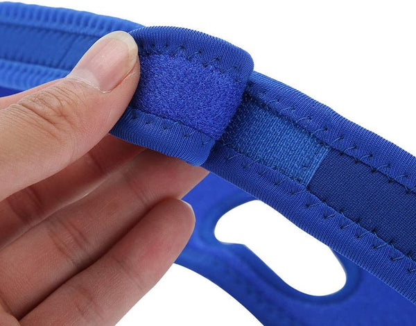 A hand is holding a blue fabric strap with a stitched seam, showcasing the Stop Snoring Chin Strap - Comfortable Anti-Apnea Solution from The Stuff Box for added comfort.