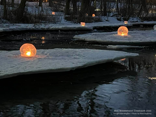 early morning ice lanterns still lit for walkers photo by Neal Hagberg wintercraft ice wrangler