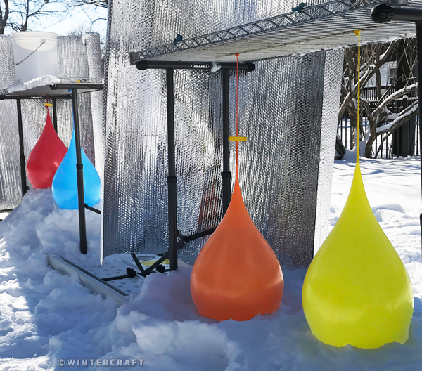 The Ice Wrangler's teardrop ice lantern set up Wintercraft 