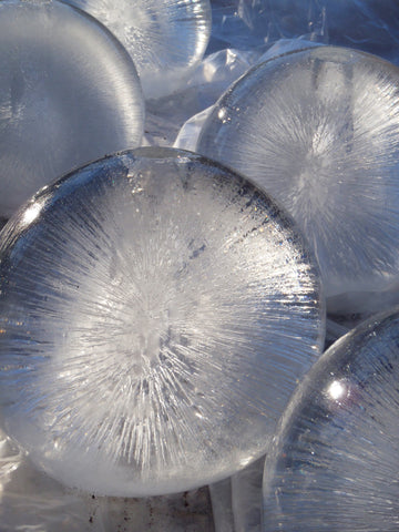 outdoor grouping of wintercraft globe ice lanterns 