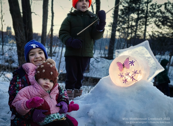 kids standing by an ice lantern mini-middlemoon creekwalk 2022 icewrangler