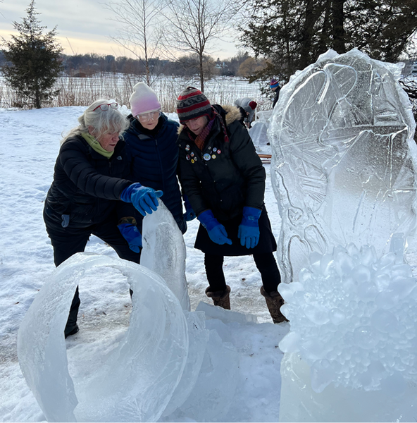 Susan, Terry and me sizing up a piece of ice for the 2023 Luminary Loppet's Enchanted Forest