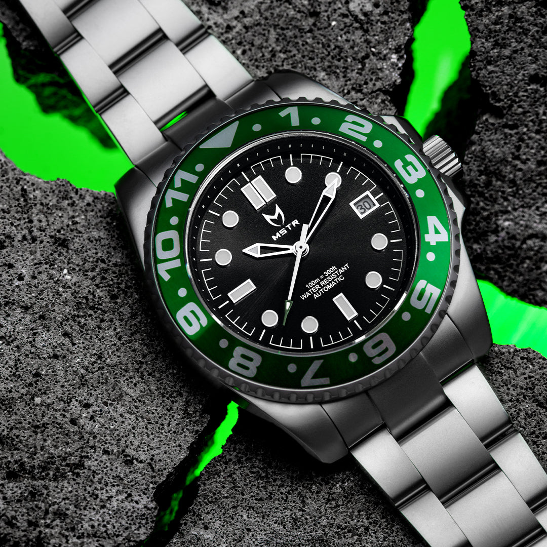 green and silver watch