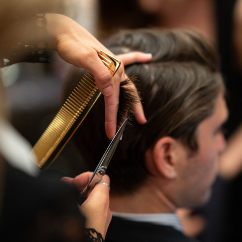 man trimming hair