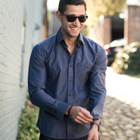 man adjusting cufflinks