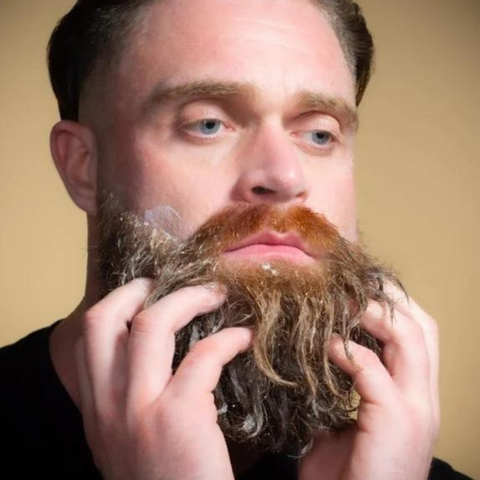 man washing beard with soap