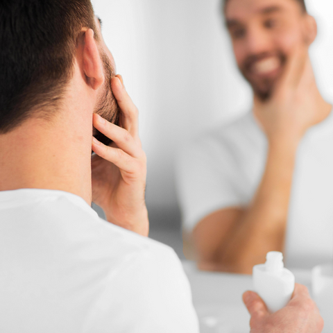 man happy with moisturizer