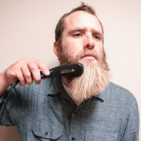 man straightening long beard
