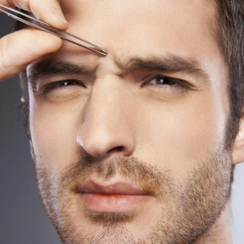 man plucking eyebrows up close