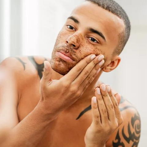 man scrubbing face