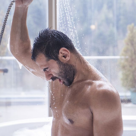man showering in cold water