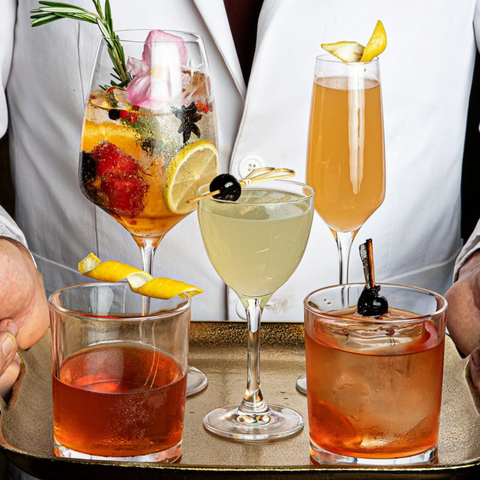 man serving beauitful coloured cocktails