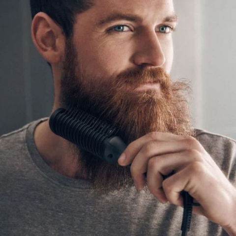 man brushing beard