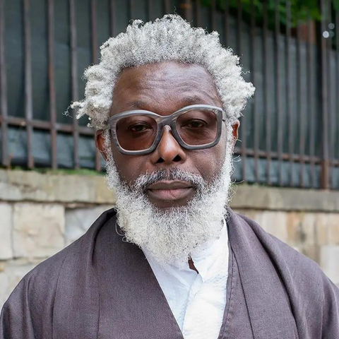 man with grey hair and cool glasses