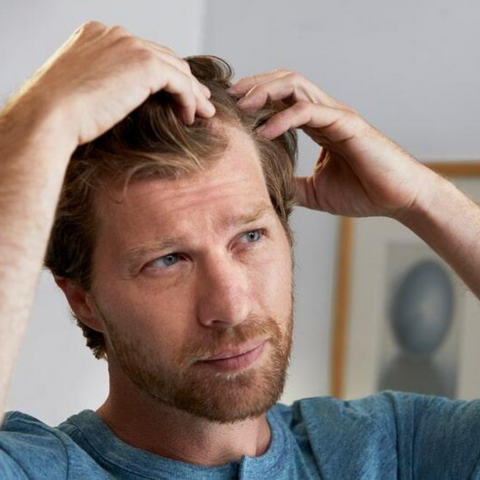 man inspecting hair type