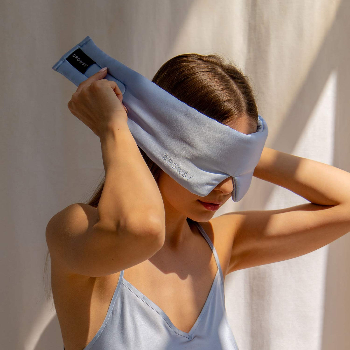 Model demonstrating the wide strapless design of Drowsy Silk Sleep Mask