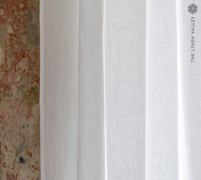 Our tie top optical white linen curtains with ruffles are designed and made to give your home a unique and timeless charm, and no matter the style of your home, linen can fit into any interior.