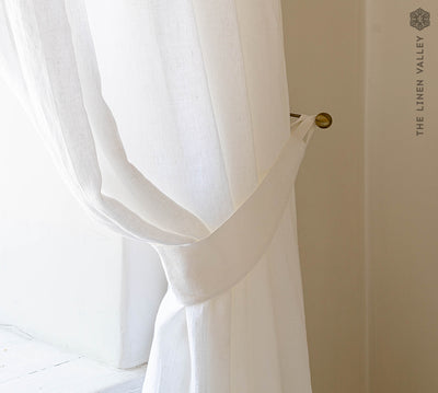 Our optical white linen curtain tie-back the perfect solution to keeping your curtains looking neat and stylish.