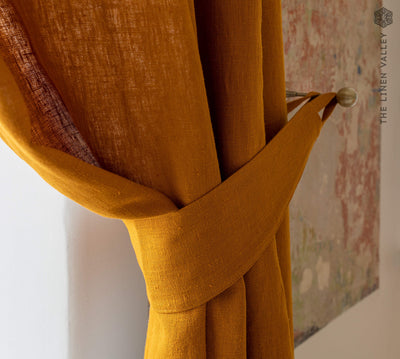 Our amber yellow linen curtain tie-back the perfect solution to keeping your curtains looking neat and stylish.