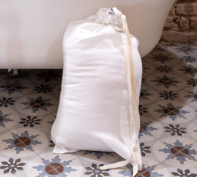 Introducing our optical white linen laundry bag, the ultimate solution for keeping your laundry organised in style.