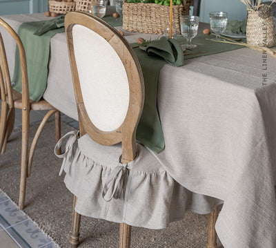 Our rustic unbleached linen slipcovers offer both practicality and aesthetic appeal.