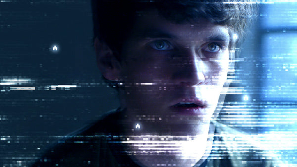 Still from Black Mirror's interactive Bandersnatch 2018 film on Netflix, showing Fionn Whitehead as Stefan Butler with distorted, glitch effect.