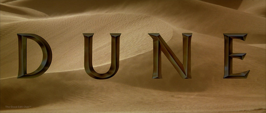 1984 Dune film title with a bronze chrome text effect on a desert-like background, reflecting the movie's themes of grandeur and the harsh, arid setting of Arrakis.