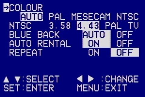 Vintage television menu screen displaying color system settings with options for PAL, NTSC, and SECAM in VCR-OSD-Mono font on a blue background.