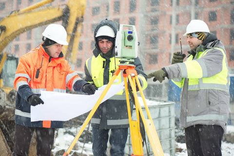 men in construction during winter with hivis jackets