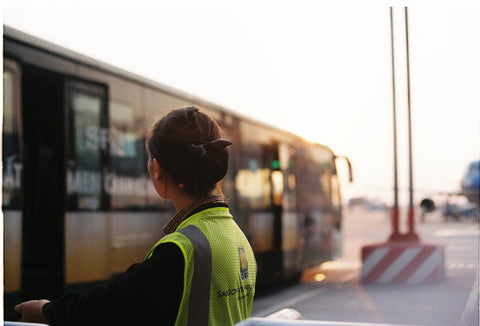 airport roadside bus worker