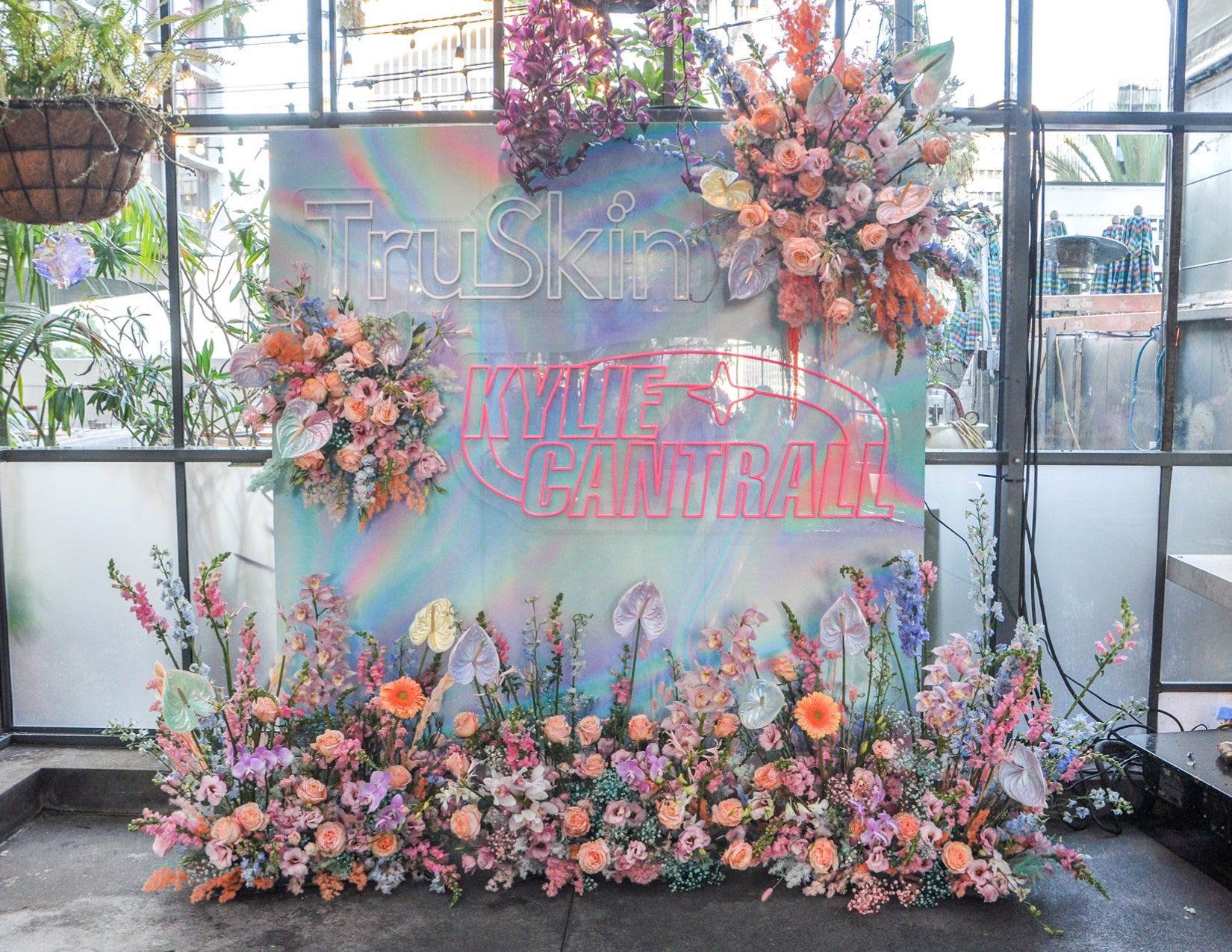 WildFlora TruSkin Kylie Cantrall Event collaboration iridescent iridescence color pastel rainbow palette anthurium ranunculus rose dahlia daisy delphinium lily orchid magical shimmer wall photo booth