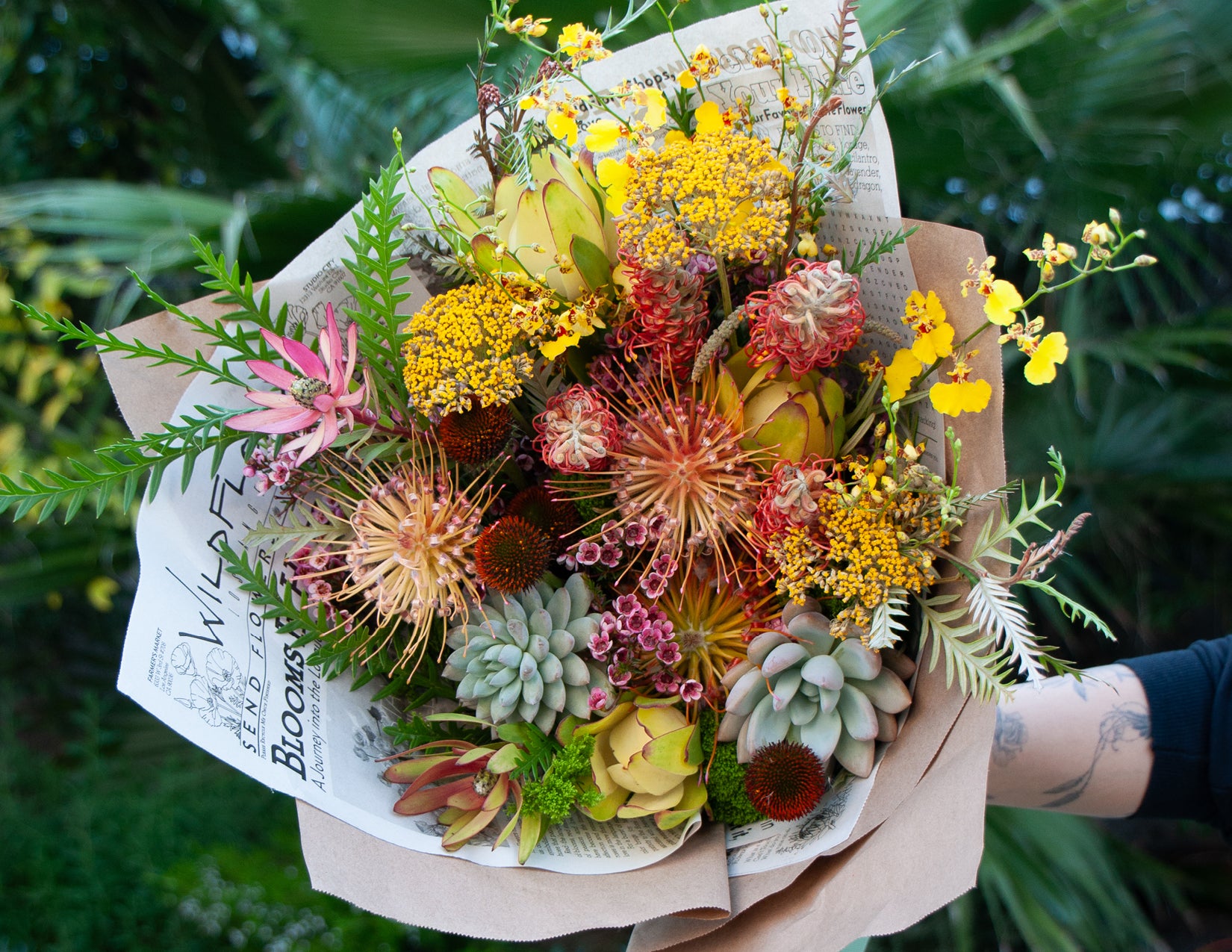 wildflora spring bouquet wrapped newspaper flowers floral arrangement los angeles tropical protea succulent unique wild crazy funky fun orchid