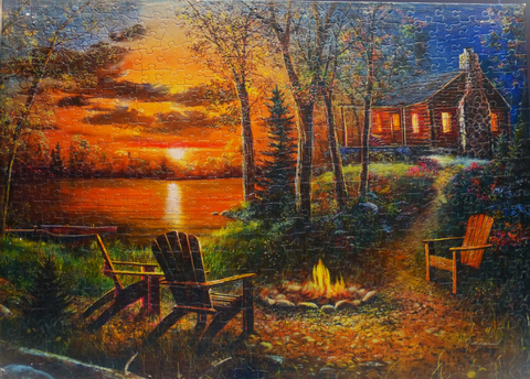 campfire by the lake with adirondack chair, sunset, cabin as a jigsaw puzzle