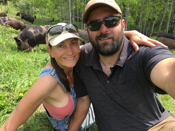 Julia & Ludo out in the field with the pigs