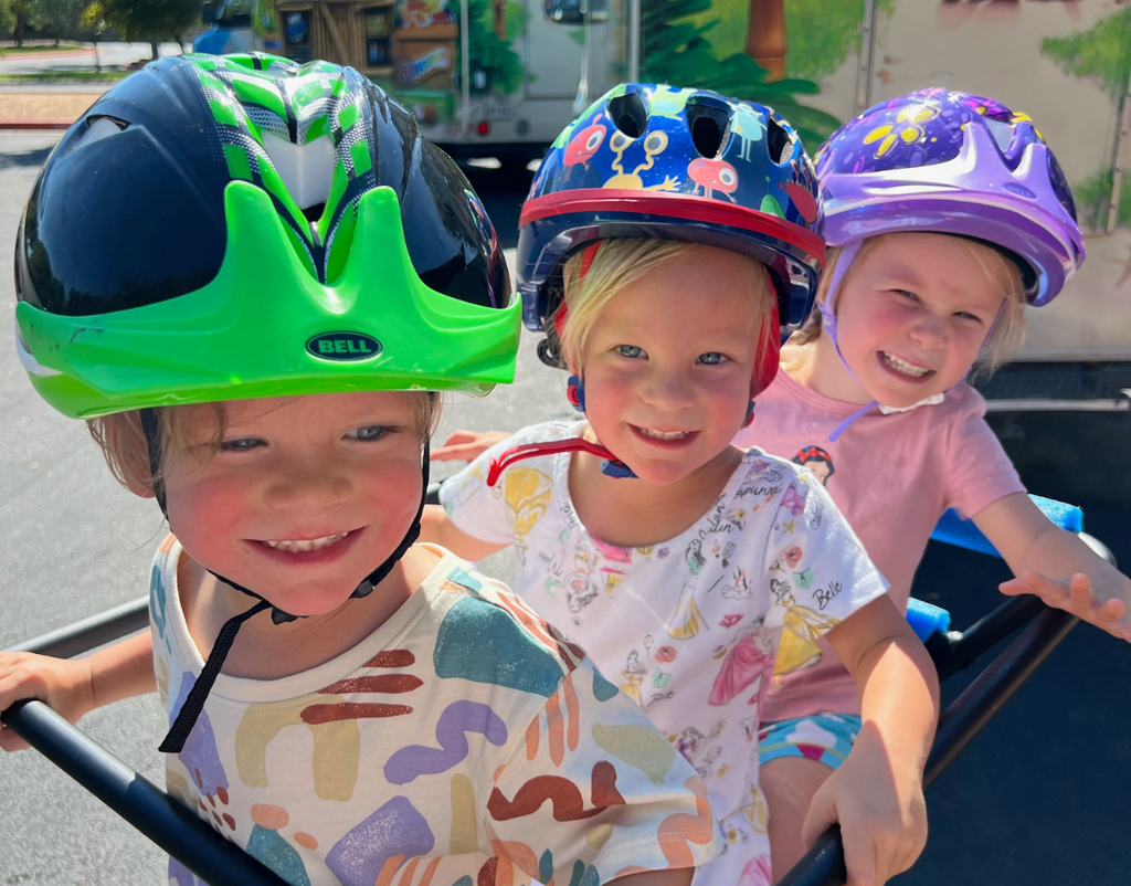 3 kids on back of Packa bike