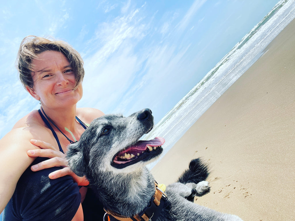 Tia with her dog, Tramp on the beach