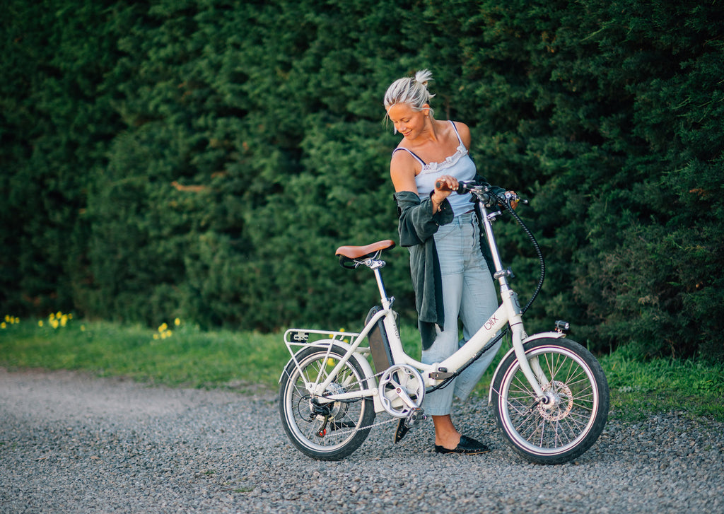 woman with bike outside