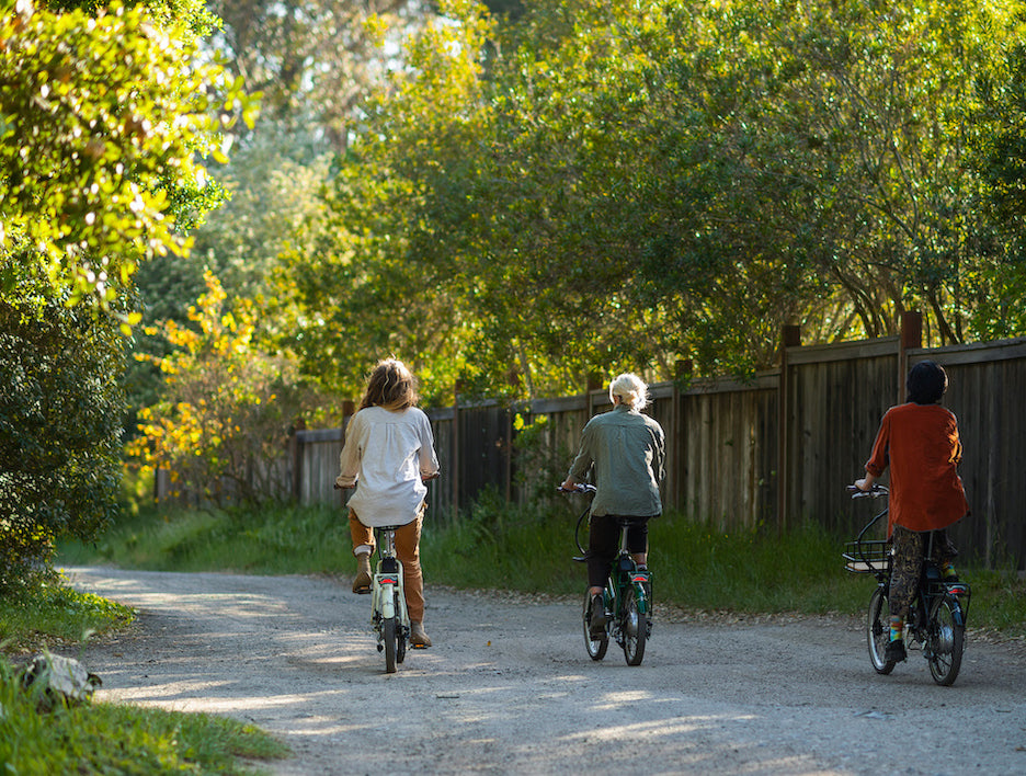 3 woman on bikes