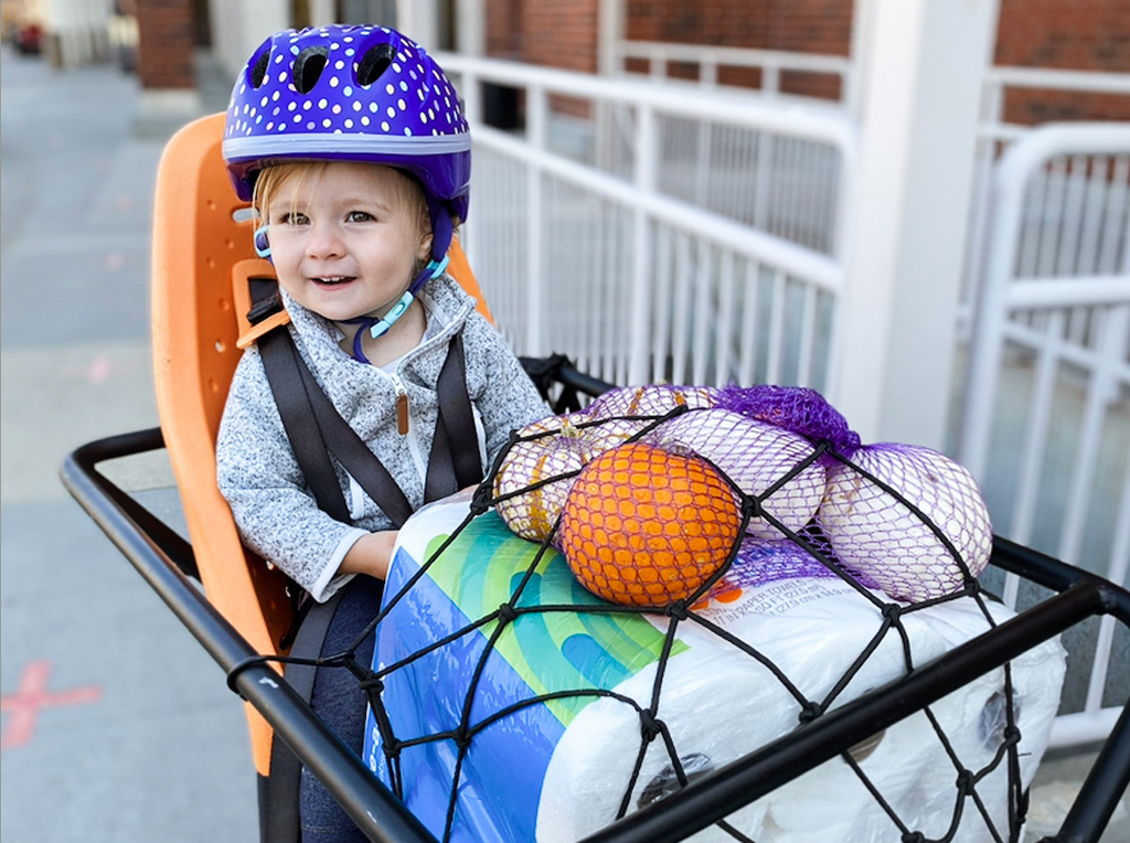 kid on back of packa bike