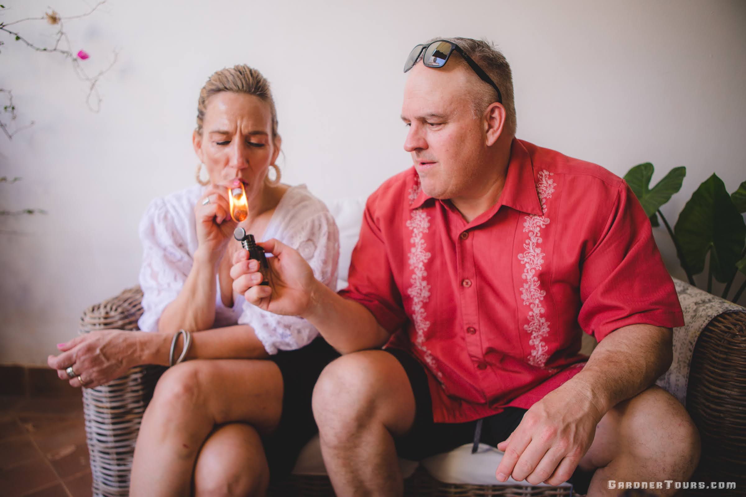 Gardner Tours Luxury Cuba Tours Custom Tour Couple Lighting a Cuban Cigar together at their Luxury BnB in Old Havana, Cuba