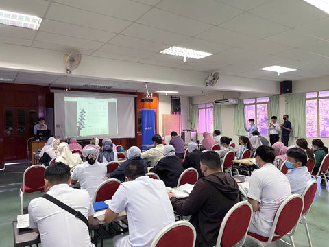 dentists are attending a training held by the ministry of health training institute and there are a lot of people attending and listening to the lecturer from the "Mr Bur" sales manager as he explains about the importance of dental burs and why mr bur provides the best dental burs globally