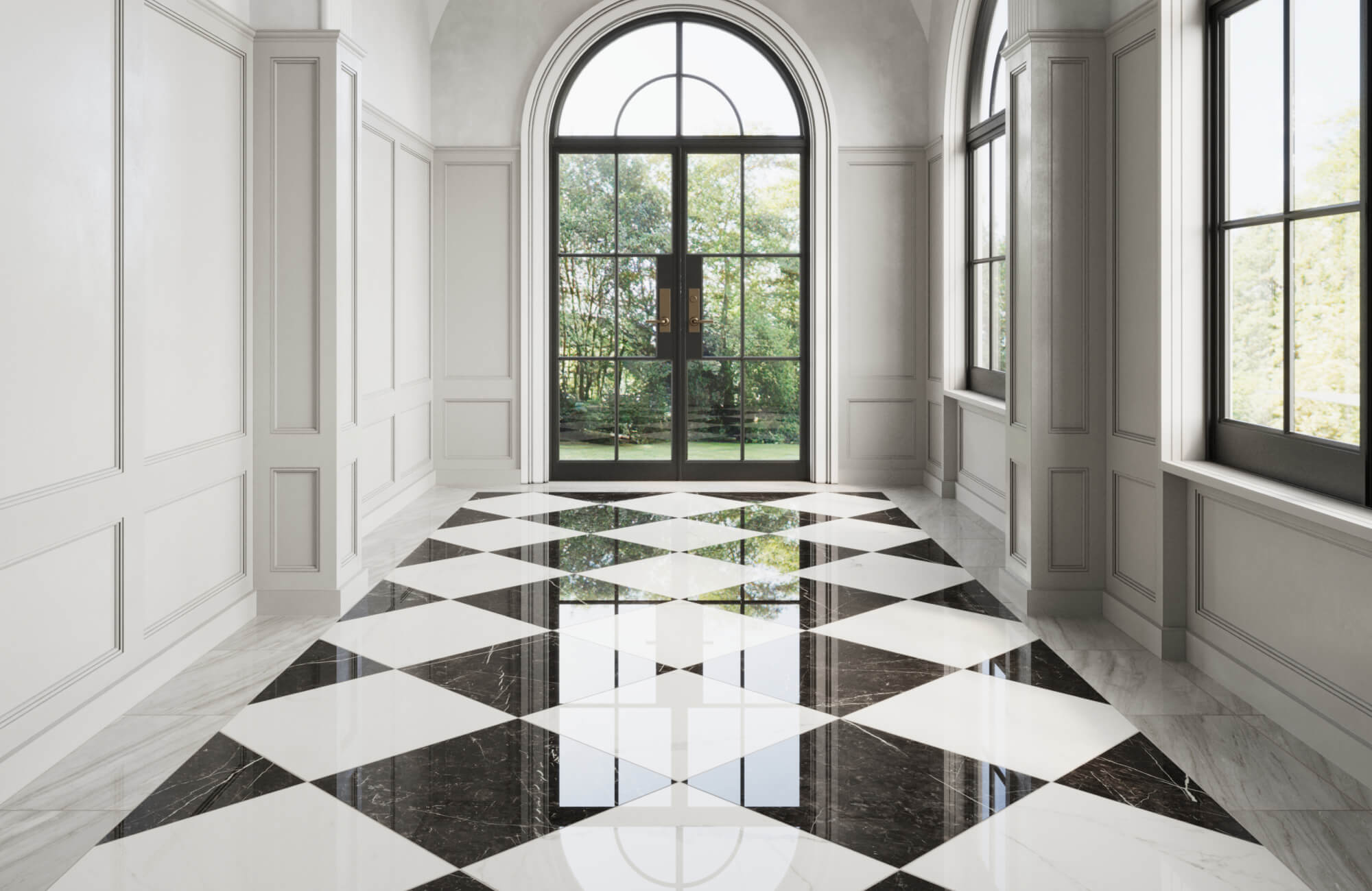 Elegant entryway featuring a polished black and white checkerboard floor, with large windows and an arched door offering a stunning view of the garden.