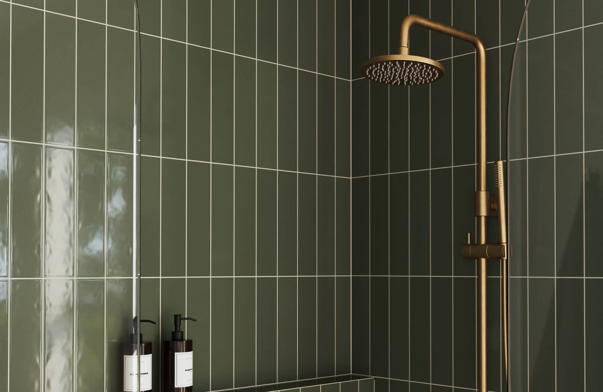 Elegant shower with deep green glossy subway tiles, contrasted by white grout and a luxe brass rainfall showerhead.