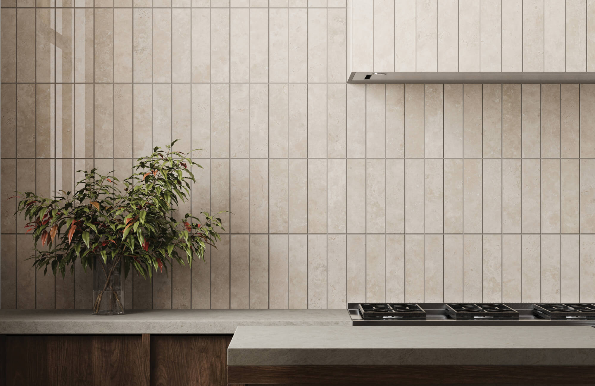 Modern kitchen featuring vertical beige subway tiles, a sleek concrete countertop, and a potted plant for a clean and minimalist design.