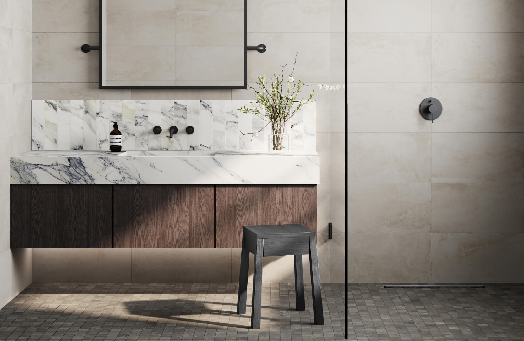 Modern bathroom with a floating vanity, marble-look sink, and neutral stone tiles, creating a sleek yet organic ambiance.