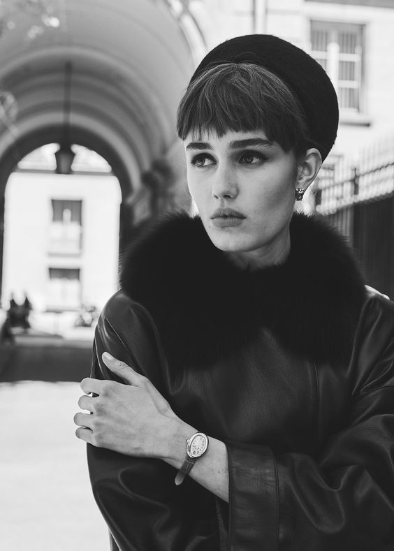 woman wearing fur and a watch