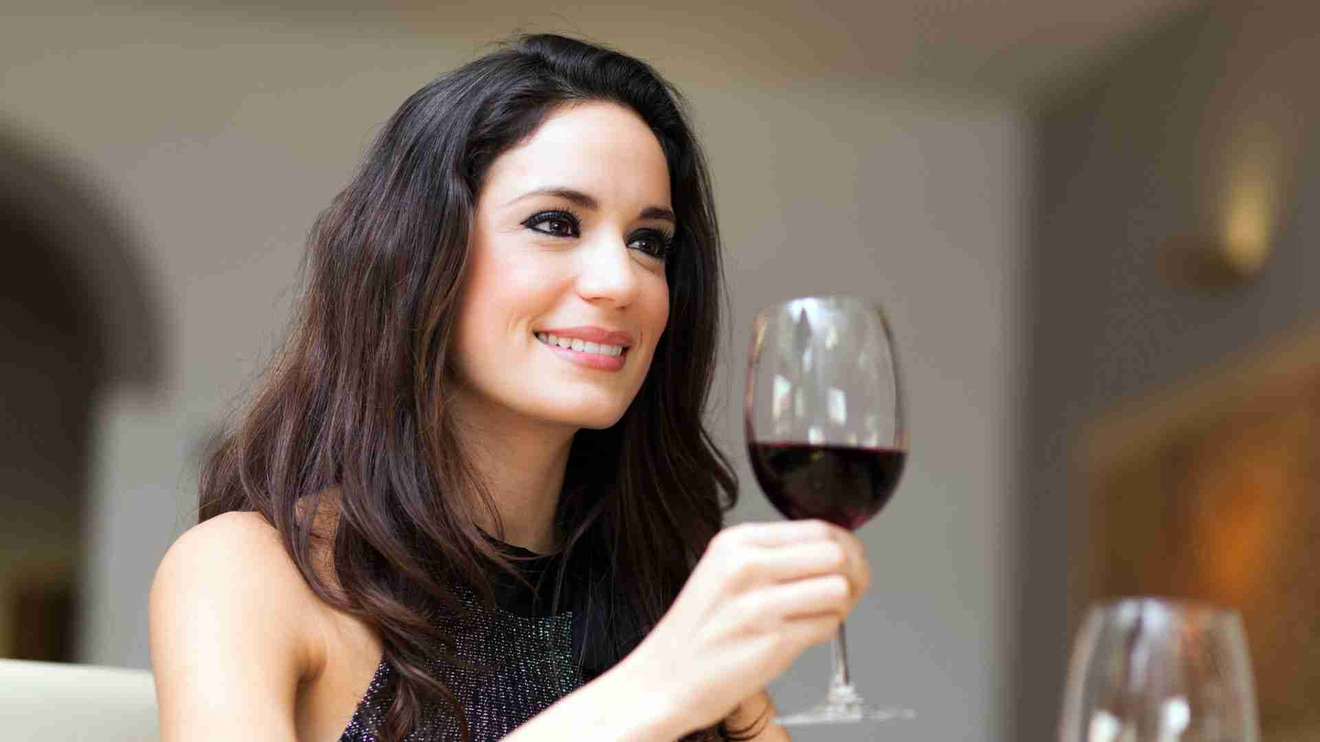 A person drinking wine