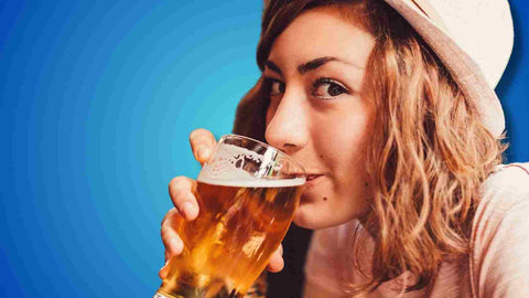 A woman drinking beer