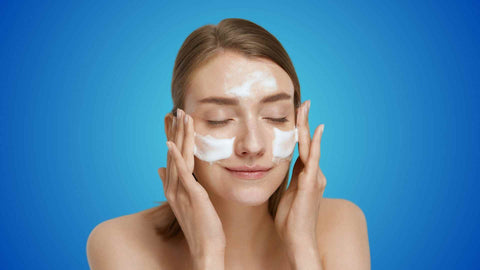 A person using face cleanser